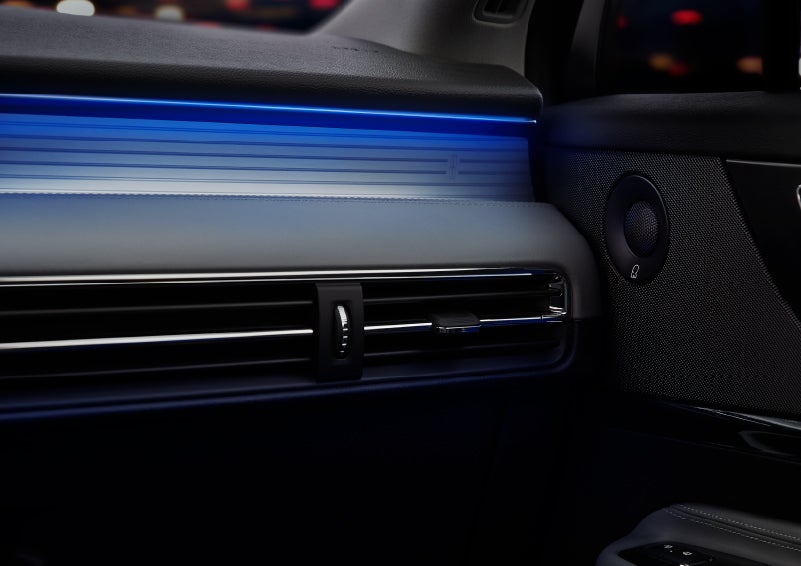 A thin available ambient blue lighting illuminates the pinstripe aluminum under an ebony dashboard, emitting a cool energy | Beck Lincoln in Palatka FL