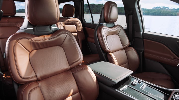 The front row's Perfect Position Seats in a 2024 Lincoln Aviator® Reserve model with Ebony Roast interior | Beck Lincoln in Palatka FL