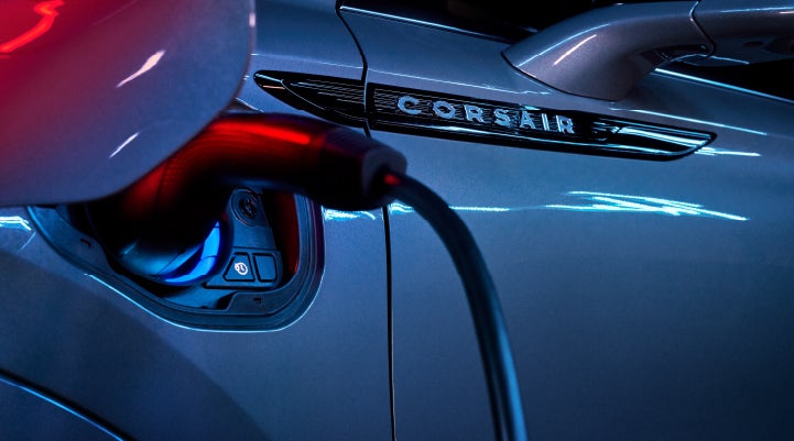A charger plugged into the charging port of a 2024 Lincoln Corsair® Plug-in Hybrid model. | Beck Lincoln in Palatka FL